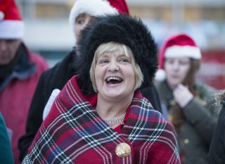 Image shown: Carol performing with The Leeside Serotones. Photo credit: Gerard McCarthy.