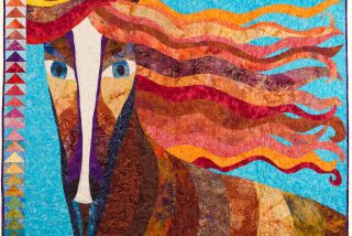 Image shown: Traveller Pride Art Quilt : 'Seek the happiness of Traveller Pride'
