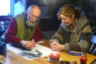 Image shown: Hearth artist working with a participant in his home